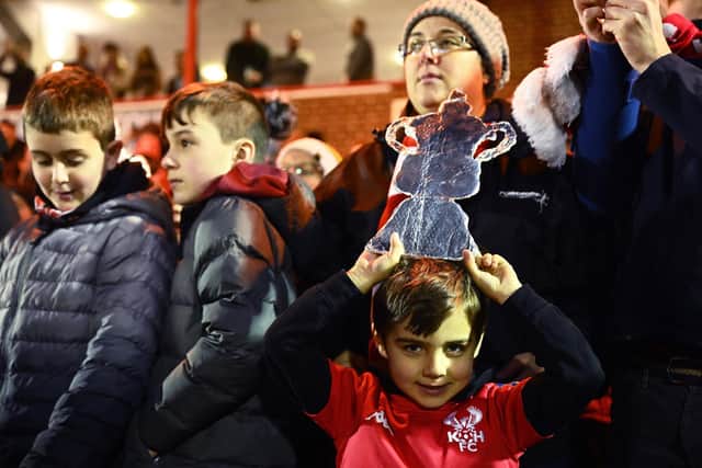 A young Kidderminster Harriers fan with a tinfoil FA Cup during Saturday's third round win against Reading. Photo by Clive Mason/Getty Images.