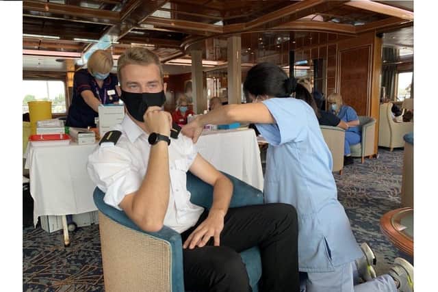 Joshua Horlock, who is a Deck Officer Cadet, receives his vaccine