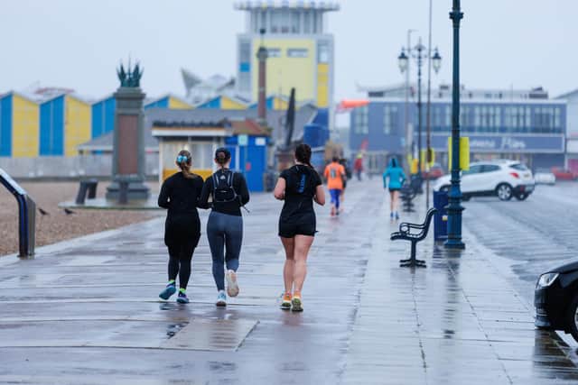 Runners hit the streets in wet and windy conditions despite The Great South Run being cancelled.