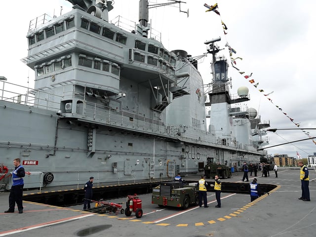 Equipment is lowered into the hull on HMS Illustrious May 10, 2013. Photo by Dan Kitwood/Getty Images