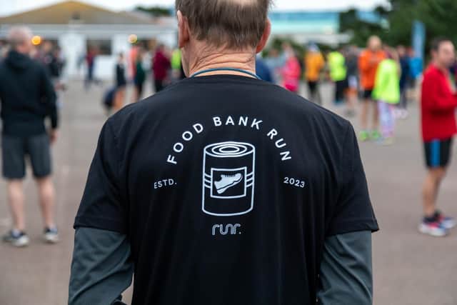 A runner wears a T-shirt in support of the food bank run. Picture: Mike Cooter (040223)