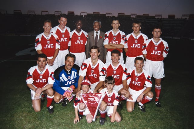 While Tony Adams was playing for Arsenal, the club became the first to win the FA Cup and League Cup double in the 1992-93 season. Pictured - The Arsenal team line up together for a group photograph with Nelson Mandela prior to a friendly match, Back Row left to right Lee Dixon, Andy Linighan, Kevin Campbell, Mandela, Alan Smith, Paul Merson and Anders Limpar, Front Row left to right Nigel Winterburn, David Seaman, Tony Adams, John Jensen and Ian Selley. (Photo by David Rogers/Allsport/Getty Images)