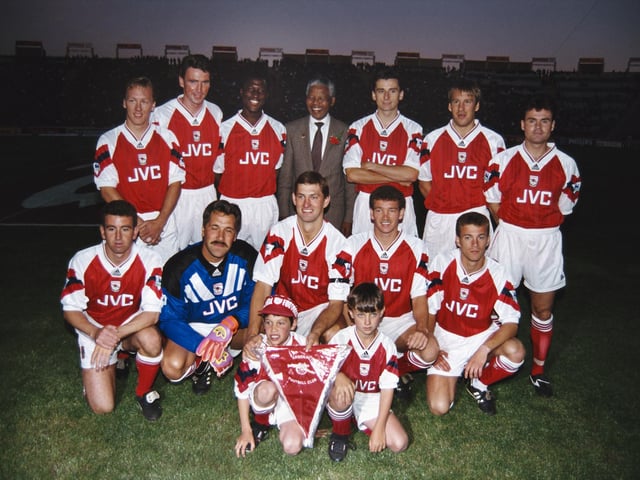 While Tony Adams was playing for Arsenal, the club became the first to win the FA Cup and League Cup double in the 1992-93 season. Pictured - The Arsenal team line up together for a group photograph with Nelson Mandela prior to a friendly match, Back Row left to right Lee Dixon, Andy Linighan, Kevin Campbell, Mandela, Alan Smith, Paul Merson and Anders Limpar, Front Row left to right Nigel Winterburn, David Seaman, Tony Adams, John Jensen and Ian Selley. (Photo by David Rogers/Allsport/Getty Images)