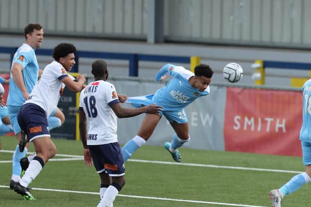 An FA Trophy turning point - Tyreace Palmer has his shirt tugged by Nico Jones - earning Notts County a penalty and the Hawks debutant a red card. Photo by Dave Haines