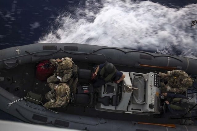 HMS Dauntless conducting a drugs intervention/rescue mission whilst operating in the Caribbean region.