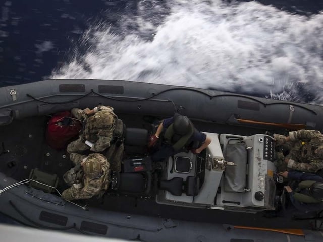 HMS Dauntless conducting a drugs intervention/rescue mission whilst operating in the Caribbean region.