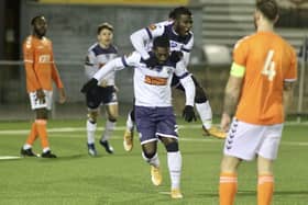 Roarie Deacon is congratulated by Daniel Ajakaiye after netting the FA Trophy winner against Braintree. Pic: Kieron Louloudis