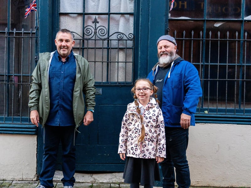 Richard Sexton, Nevaeh Mehmet (6) and Pete Codling at the unveiling of the restored 'Lion of Portsea'. Photo by Matt Clark