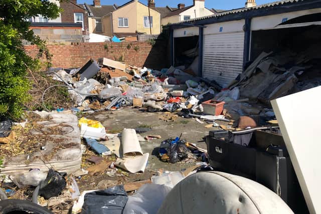 Huge amounts of rubbish - ranging from wooden furniture to children's toys - have built up over months of illegal dumping in this North End car parking site.