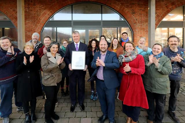 Cllr Sean Woodward of the Partnership for South Hampshire (centre) presents the People's Choice Award of the Solent Quality Space Awards to architect Deniz Beck (centre left), Cllr Steve Pitt (centre right), artists and well-wishers at the Hotwalls, Old Portsmouth, in 2020.
Picture: Chris Moorhouse (150120-23)