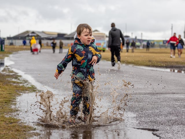 Louis Charley (4) from Portsmouth making full use of the puddles on site at Victorious. Picture: Mike Cooter (240824)