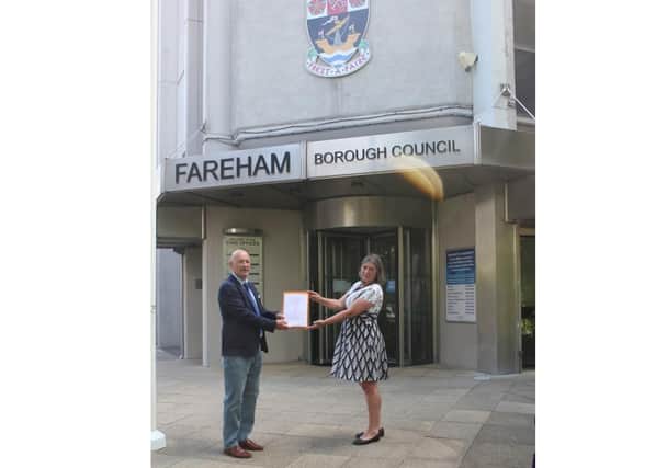 Tony Goodridge from the Save Our Strategic Gaps Facebook group and Zoe Aspinall from the Green Party arrive at Fareham Borough Council to hand in the petition. Picture: Tony Goodridge.