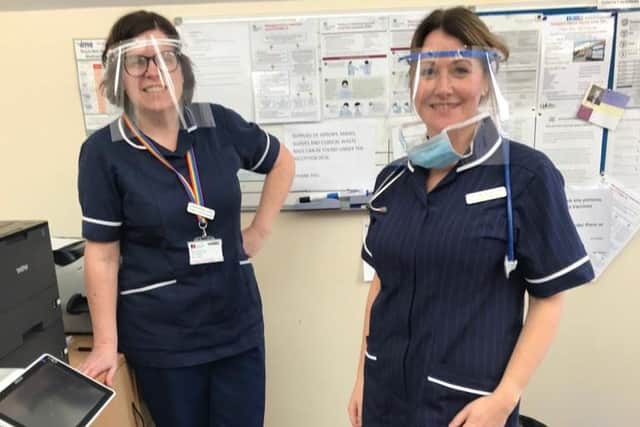 GP surgery staff wearing the protective visors