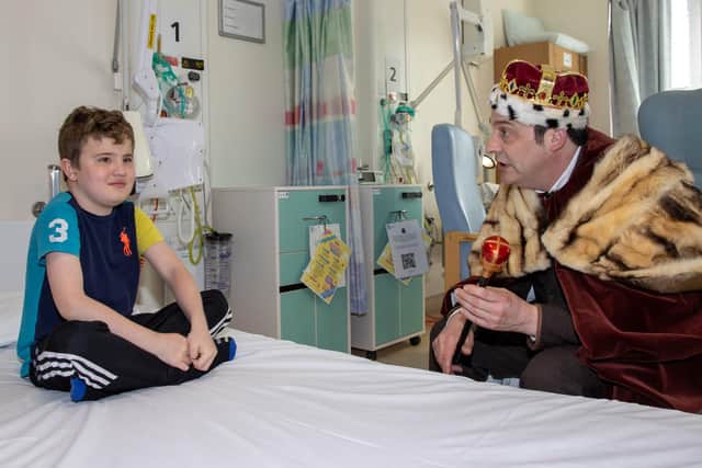 Pictured - Teddy Smith, 9 from Drayton was surprised by the 'King' when he arrived at the ward.
Photos by Alex Shute