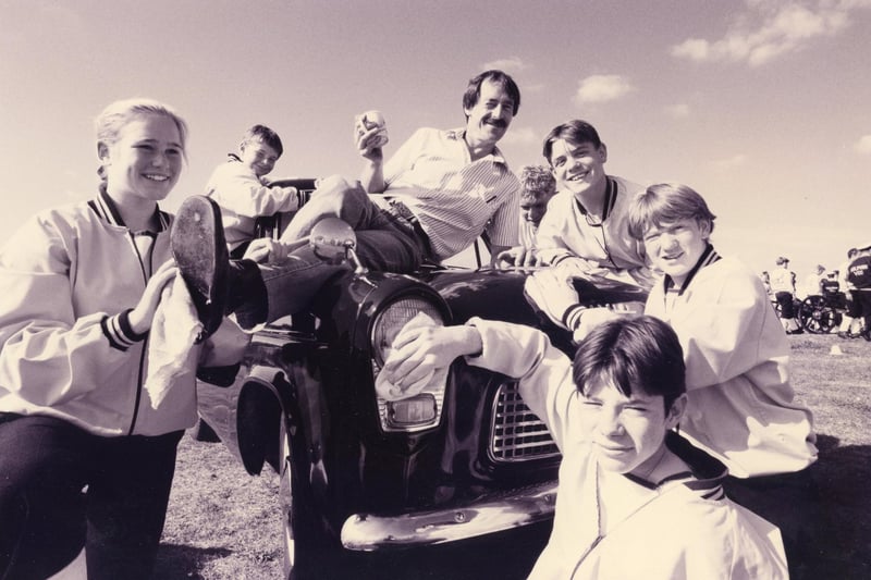David Russell takes a rest as cadets from Dolphin Field gun crew give his Ford Popular that extra shine in preparation for the Cortinas owners club rally in Gosport. From 1993. The News PP3020