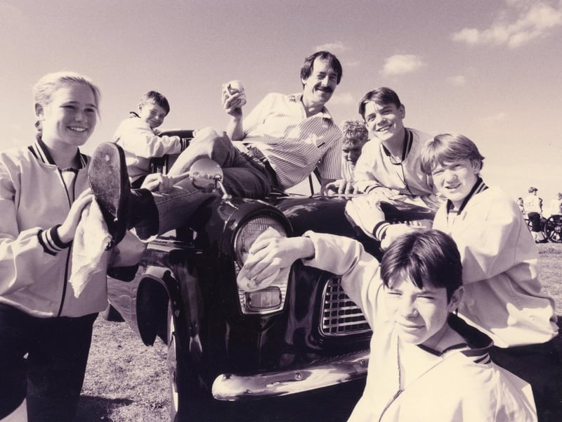 David Russell takes a rest as cadets from Dolphin Field gun crew give his Ford Popular that extra shine in preparation for the Cortinas owners club rally in Gosport. From 1993. The News PP3020