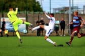Gosport striker Harvey Bradbury (middle) in FA Cup action at Hamworthy. Picture by Tom Phillips