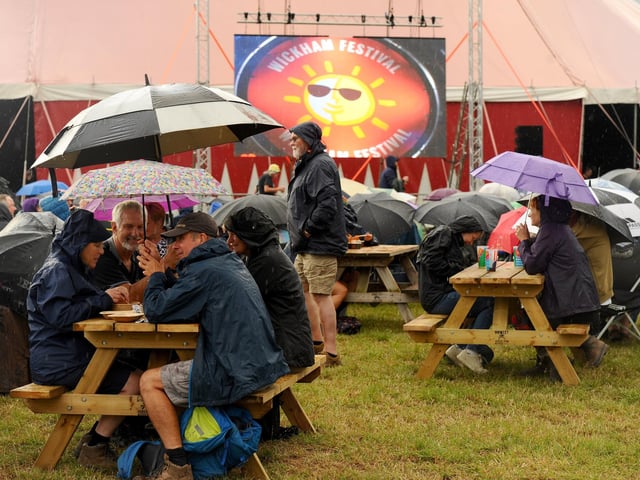 Festivalgoers hoping for the real sun to come out.  Picture: Sarah Standing (310725-1263)