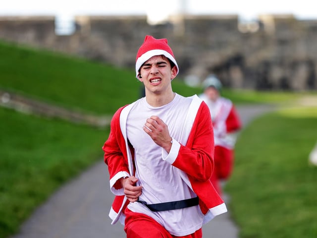 A number of runners took to the picturesque coastal route to take on the Portsmouth Coastal Waterside Marathon, Festive Half Marathon, as well as the Southsea 5k and 10k Turkey Trot. Picture: Chris  Moorhouse (221224-70)