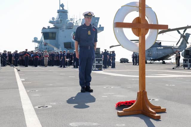 Handout photo issued by the Ministry of Defence (MoD) of Captain Ian Feasey, Commanding Officer HMS Queen Elizabeth, after he laid a wreath during a Remembrance Sunday service on the flight deck of HMS Queen Elizabeth, whilst on deployment with the Carrier Strike Group 21(CSG21) as part of Operation Fortis. Picture date: Sunday November 14, 2021.