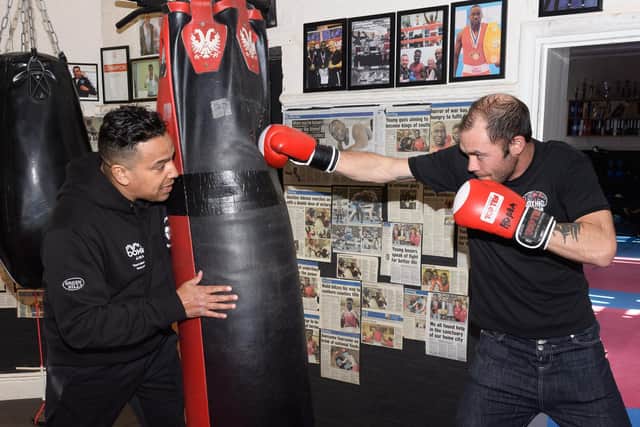 Pictured is: Quinton "Q" Shillingford instructs Warren Avery, the club's first student to pass all his exams.
Picture: Keith Woodland (120420-9)