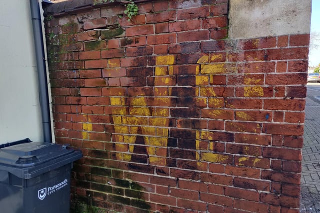 A wall painted with SWS, which stands for static water supply. The sign was useful in the Second World War when fire crews needed to know the locations of guaranteed water supplies.