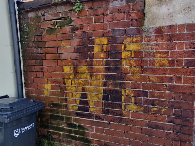 A wall painted with SWS, which stands for static water supply. The sign was useful in the Second World War when fire crews needed to know the locations of guaranteed water supplies.