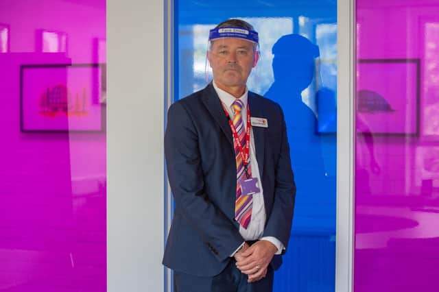 Portsmouth College principal, Simon Barrable, wearing a protective visor during A-level results day.

Picture: Habibur Rahman