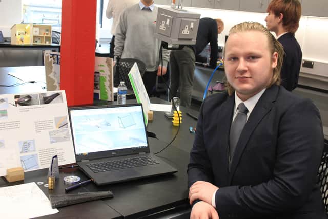 T Level student Adam Tier with his 3D print designs for an F-14 Tomcat.