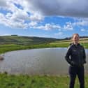 Park ranger Sophie Brown next to a restored dew pond near Arundel.  

Jeff Travis/PA Wire