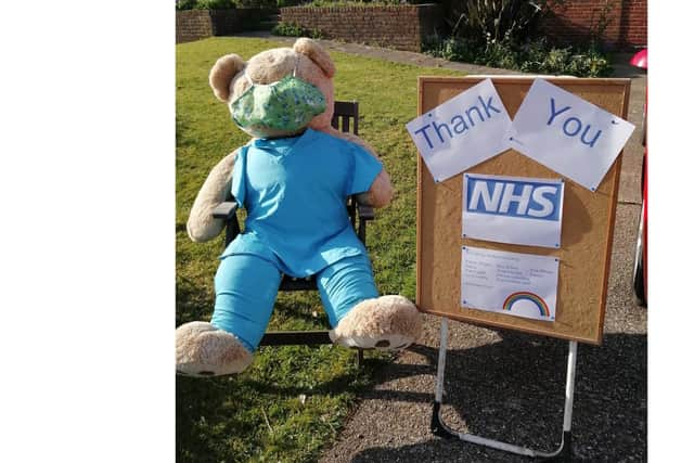 The bear got changed into borrowed scrubs to show his support for the NHS. Picture: Nicki Smith