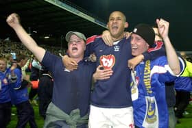 Pompey supporters with Nigel Quashie after the win against Burnley. Picture by Jonathan Brady.