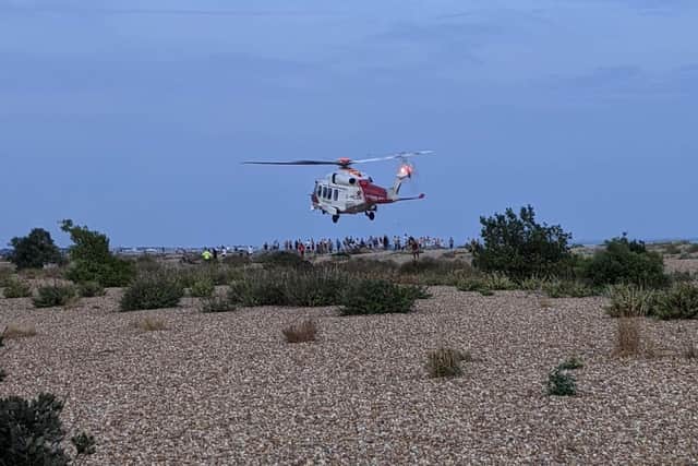 A coastguard helicopter lands on Eastney beach this evening. Photo: Matthew Bissaker.