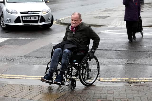 Steven Kingett, a wheelchair user, is going shows us some of the worst areas and kerbs for access.
Picture: Sam Stephenson