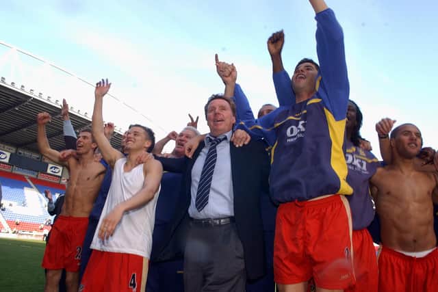 Harry Redknapp celerates with his players at the JJB Stadium.  Picture: Steve Reid