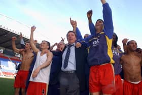 Harry Redknapp celerates with his players at the JJB Stadium.  Picture: Steve Reid