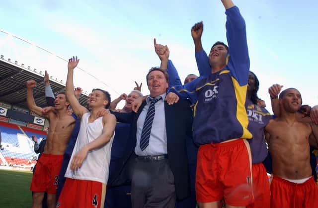 Harry Redknapp celerates with his players at the JJB Stadium. Picture: Steve Reid