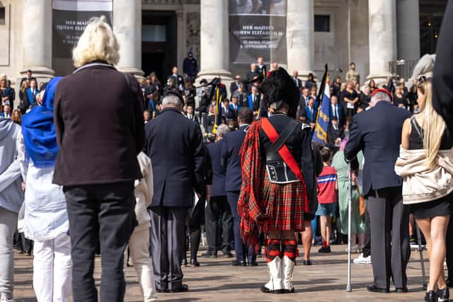 Heads bowed during ther minutes silence in Guildhall Square. Picture: Mike Cooter (180922)
