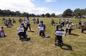 A crowds gathered to read the names of people from the BAME community who have died in police custody and due to Covid-19