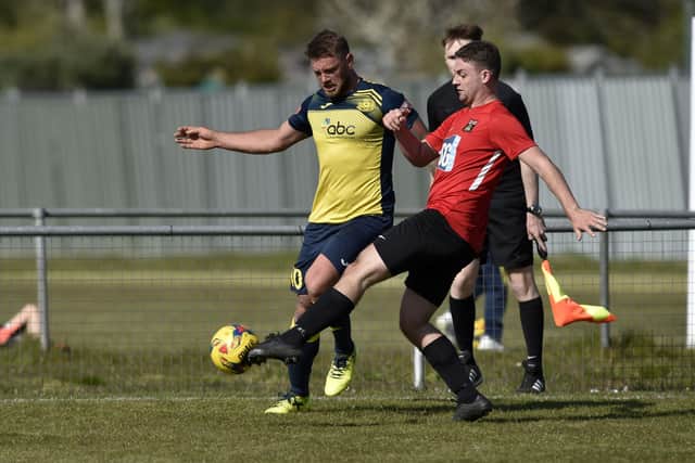 Steve Hutchings (yellow) has scored 140 goals in six Wessex League seasons for Moneyfields. Picture: Allan Hutchings