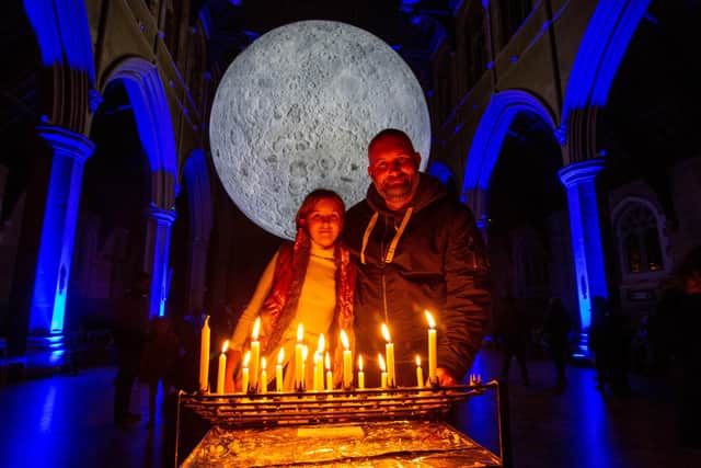 Chris and his daughter Scarlett Berry, 10 l at St Marys Church, Fratton, Portsmouth, with The Museum of The Moon
Picture: Habibur Rahman