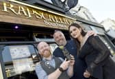 Rapscallions in Osborne Road, Southsea, is expanding into Port Solent. Pictured is: (middle) Dan Swan, owner, with Zak Brown, general manager and Naahzat Mozumder, assistant general manager. Picture: Sarah Standing (080623-4984)
