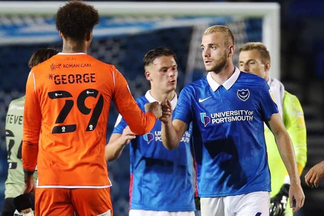 Jack Whatmough shakes hands at full-time following Pompey's win over Colchester. Picture: Joe Pepler