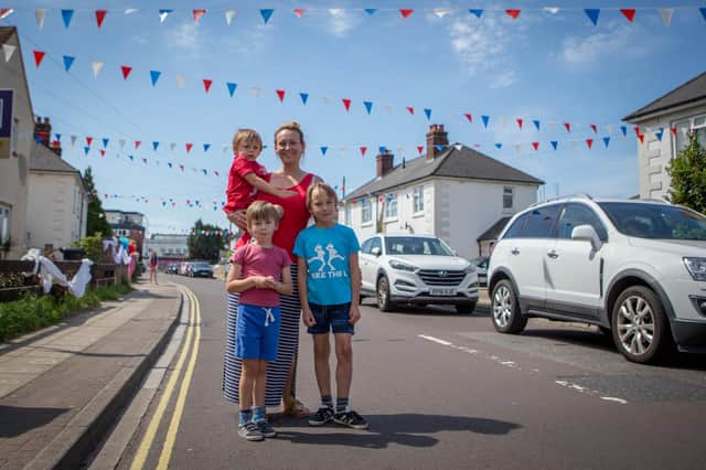 VE Day celebrations at Peronne Road, Portsmouth.Pictured: Polly McRichards with her children, Dylan 7, Sonnie 4 and Alfie 2.Picture: Habibur Rahman