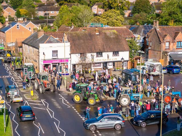 Crowds gathered in Wickham Square to watch the procession of tractors go by all to raise money for Rowans Hospice and Guide Dogs.