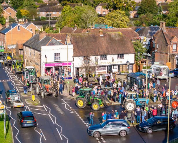 Crowds gathered in Wickham Square to watch the procession of tractors go by all to raise money for Rowans Hospice and Guide Dogs.