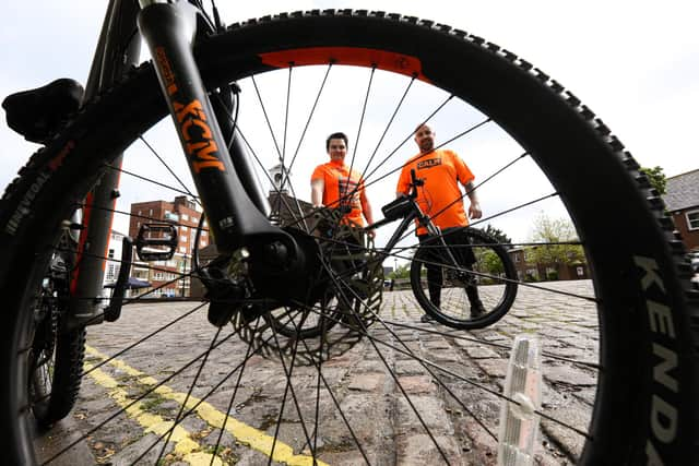 In February Kyle Gray, right, and Ash Gorin will be riding to North Wales, climbing Snowdon and riding back in aid of CALM, the suicide awareness charity. They are pictured near St George's Church, Portsea
Picture: Chris Moorhouse (jpns 160521-18)