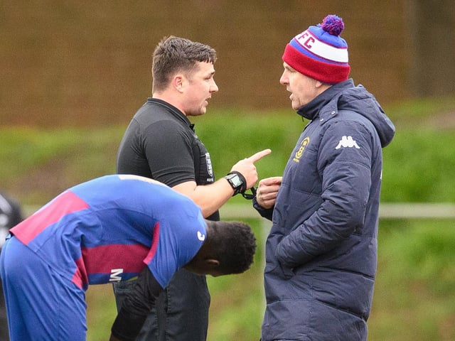 Referee Harry Scott about to book US Portsmouth manager Frazer Quirke. Picture: Keith Woodland