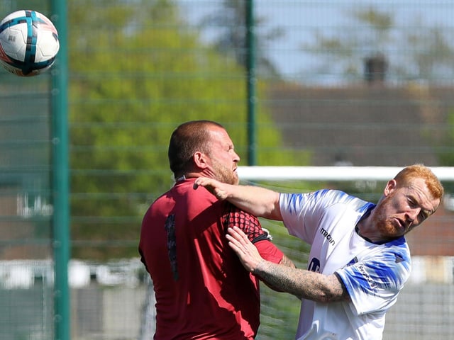 Denmead keeper Darren Joseph and Clanfield's Harvey Cooper collide. Picture: Chris Moorhouse