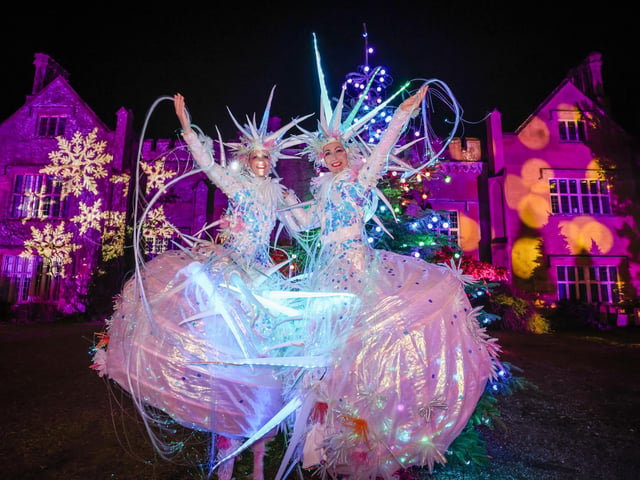 Snow Queens in front of Marwell Hall at Glow Marwell